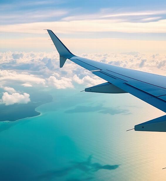 looking out plane window at wing and islands below